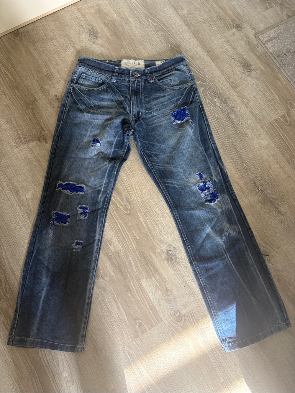 Relaxed Fit Distressed Blue Jeans